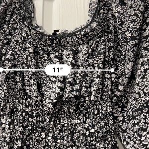 Black and white flowery dress with teeny tiny bits of red, fit and flare